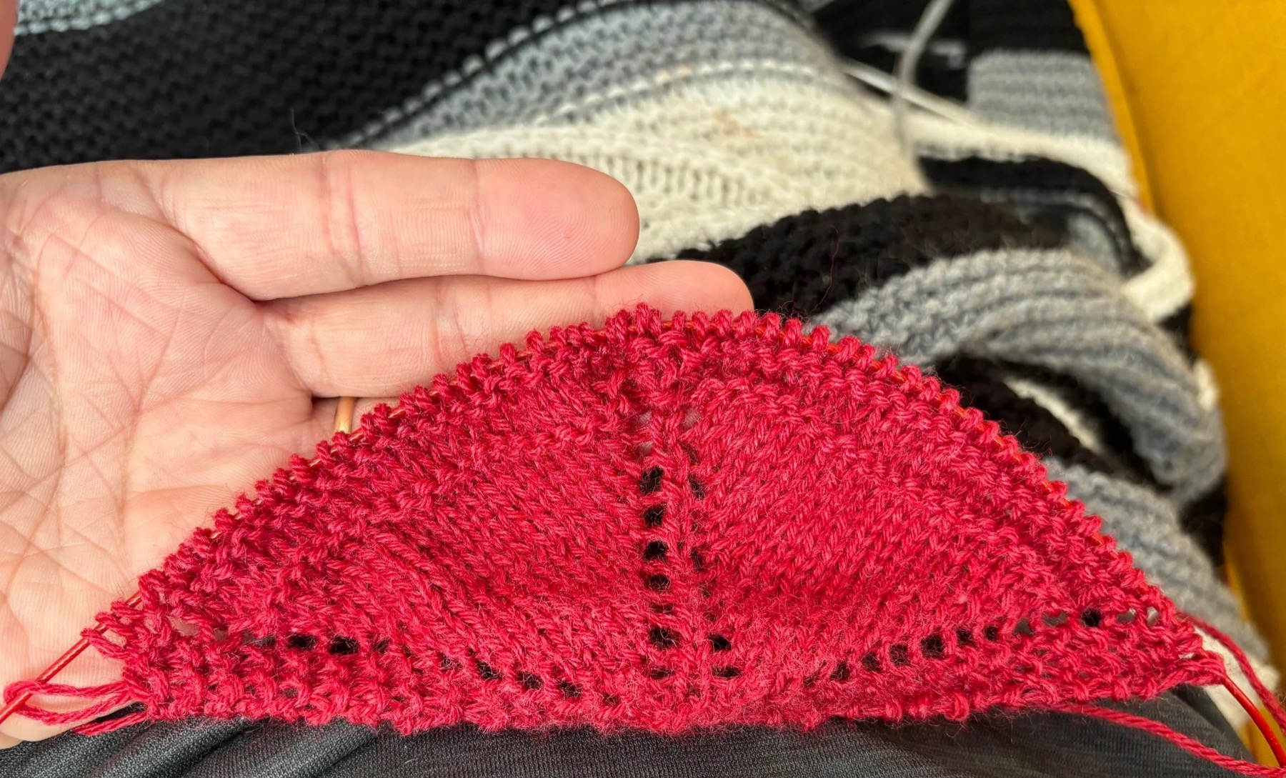 Red merino wool rebozo on the needles